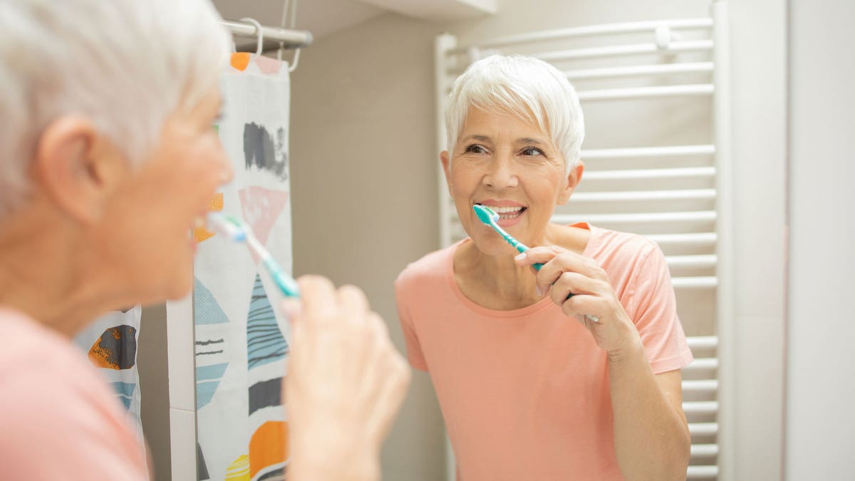 Great woman brush your teeth