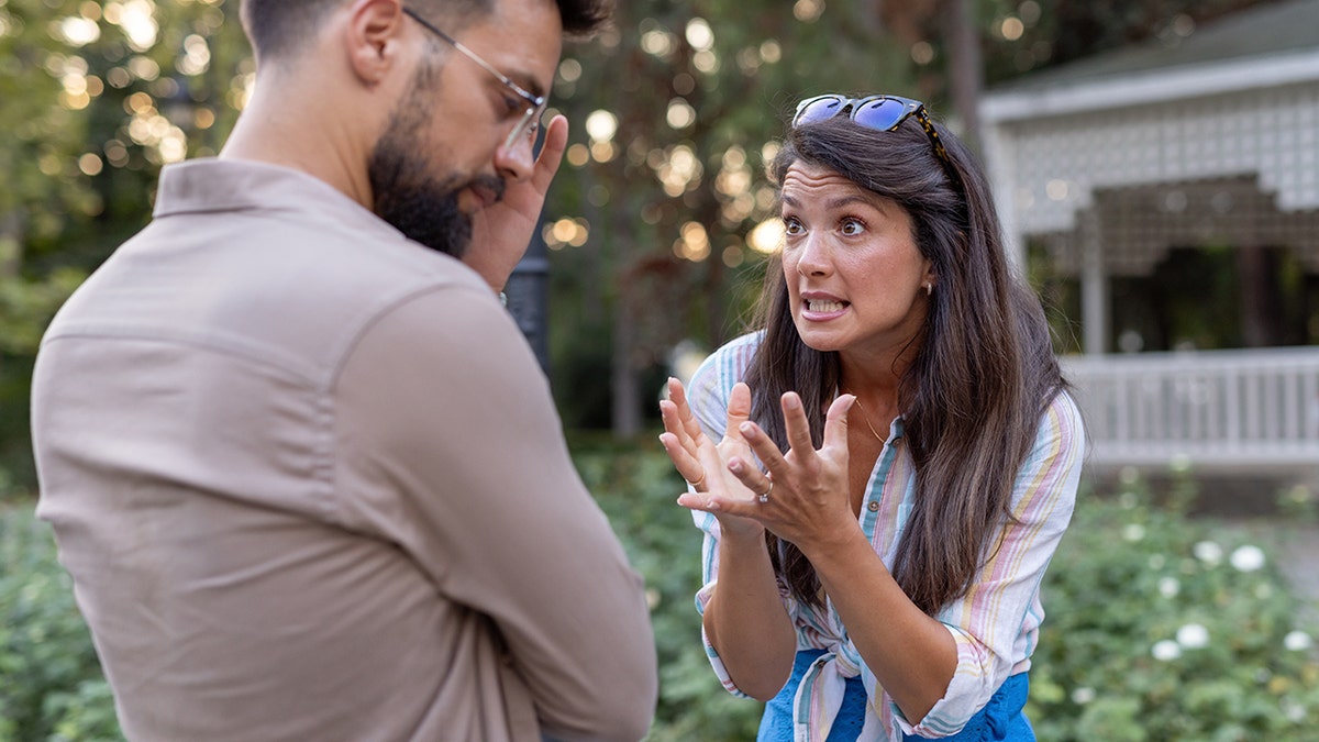 The woman argues with the man from outside